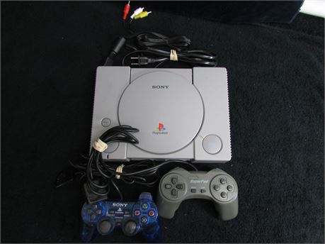 PLAYSTATION CONSOLE WITH 2 CONTROLLERS AND ALL HOOK UP CORDS