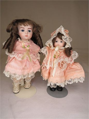 2 Decretive Porcelain Dolls With Stands
